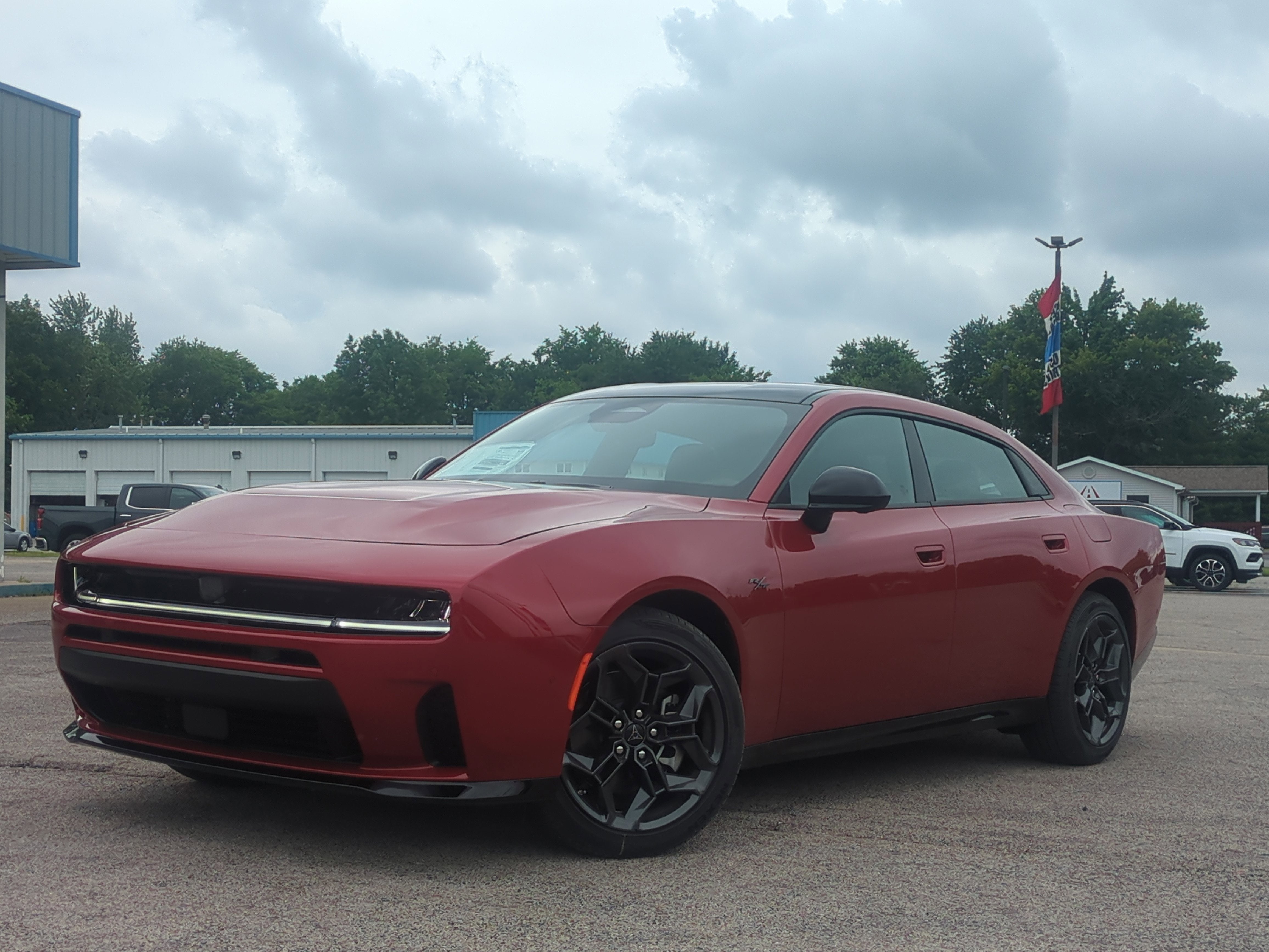 2026 Dodge Charger CHARGER R/T PLUS 4-DOOR AWD in Redeye Exterior Paint — front three-quarter view